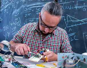 Tech postgraduate student working on electronic project
