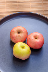 Plate with apples. Autumn layout. Fruit apples. Autumn picture. . Apples and autumn leaves
