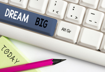 Writing note showing Dream Big. Business concept for To think of something high value that you want...