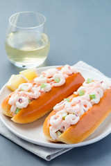 Shrimp rolls with hot dog brioche bun and shrimp salad, vertical