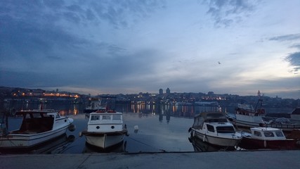 Fototapeta na wymiar boats at harbor in golden horn gulf in Istanbul