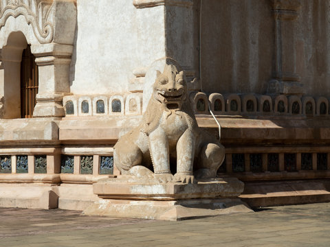 Statue of Chinthe or Leogryph with double -body sitting at the corner of Ananda Temple, Myanmar. Chinthe statue always seen in Myanmar temples as guardian.