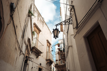 Fototapeta na wymiar MARTINA FRANCA, ITALY / SEPTEMBER 2019: Tiny streets in the old town