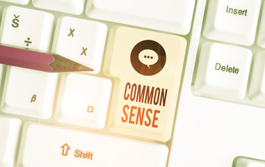 Writing note showing Common Sense. Business concept for having good sense and sound judgment in practical matters White pc keyboard with note paper above the white background