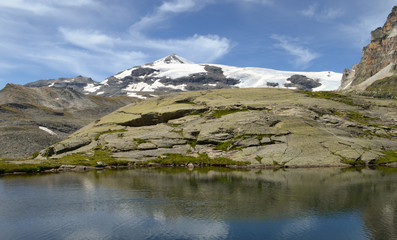 from the lakes of lozieres, in the distance, the dome de chasseforet in the vanoise massif in the heart of the french alps