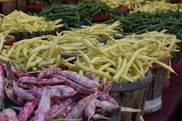 Picture of fresh multicolored beans for sale on the market.