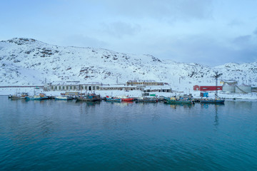 Port of Teriberka village on a February morning (shot from a quadrocopter). Murmansk region, Russia