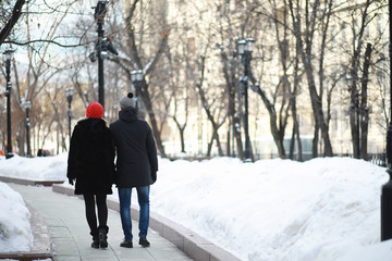 Young couple walking through the winter