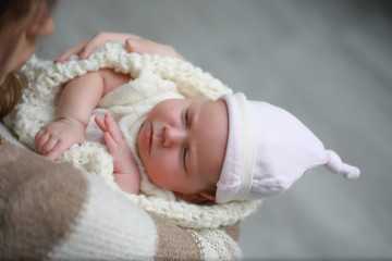 Baby newborn sleeping wrapped up in a blanket