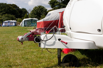 Touring Caravan hitch on a campsite in the summer. 