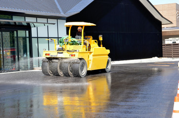 Heavy equipment "tire roller" paving the road