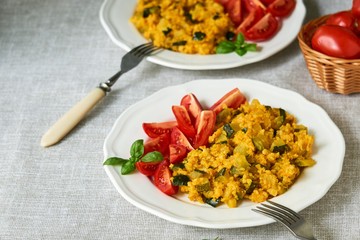 Spicy millet porridge with zucchini and tomatoes