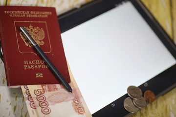 The graph of income growth. Electronic tablet with a graph of growth rates of profit. The currency on the chart on the smartphone.