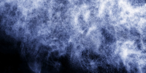 A stream of water and a cloud of drops