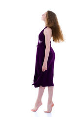 Little girl in a dress developing in the wind.