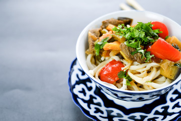 National asian tasty  dish lagman in a plate on table background
