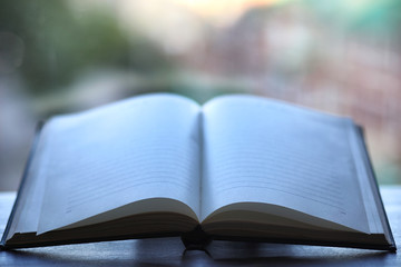 open book and a table