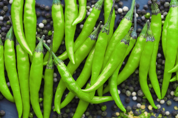 Hot green pepper. Chilean pepper on a black.