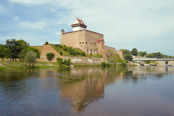Fototapeta na wymiar View of Herman Castle on a cloudy August day. Narva, Estonia