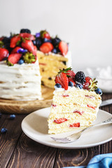 Rustic Cake With Fresh Berries on a wooden background