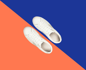 White sneaker on blue and orange color contrast background