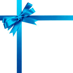 Light blue gift ribbon bow vertical top corner border frame isolated on white.