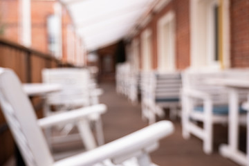 Benches and chairs in a street cafe. 