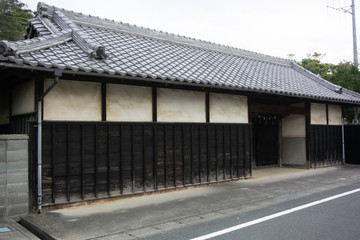 Fototapeta na wymiar Traditional gate of old house in Shirasuka on old Tokaido road in Kosai city, Shizuoka prefecture, Japan.