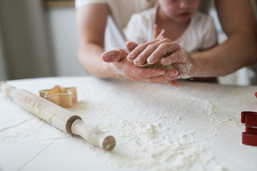 girl with Down syndrome with family in the kitchen