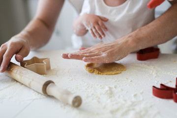 girl with Down syndrome with family in the kitchen