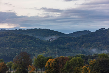 rainy clouds above green forest 