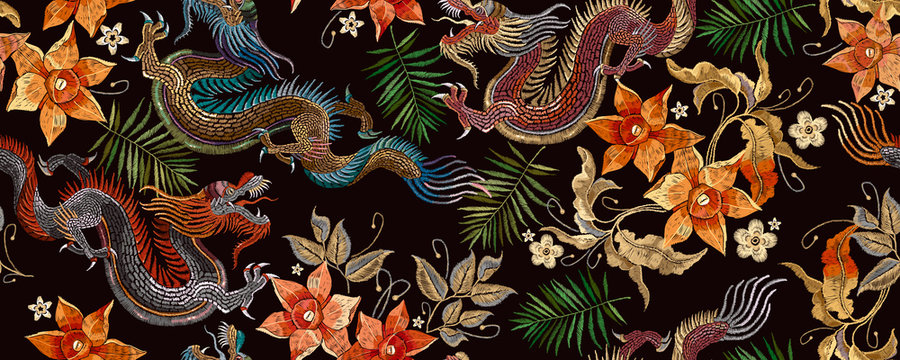 Embroidery Asian Dragon And Beautiful Yellow Daffodils Flowers Seamless Pattern. Oriental Style. Japan And China Art