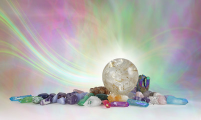 Rutilated Quartz Crystal Sphere Background - beautiful massive quartz ball surrounded by assorted...