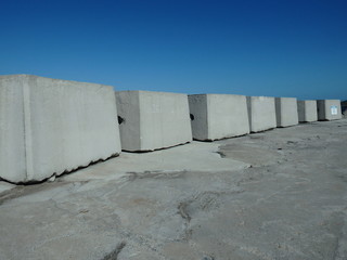 Heavy block of concrete on a breakwater barricade