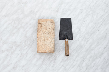 Brick trowels lie on a light background top view. copy space. Concept construction building repair.