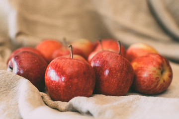 Ripe red apples as background, macro view of fresh and juicy apples. Healthy eating. Vegan food.