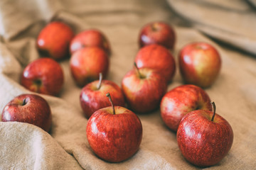 Ripe red apples as background, macro view of fresh and juicy apples. Healthy eating. Vegan food.