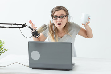 Radio host concept - Young woman working as radio host at radio station