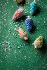 Christmas decorations and snow on green background