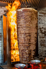 Authentic turkish doner kebab rolling outside of a restaurant on the streets of Istanbul, Turkey.