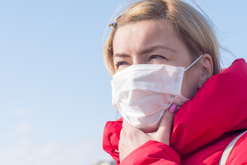 Woman wearing face mask because of air pollution in the city