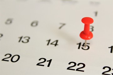 calendar and pushpin on white background