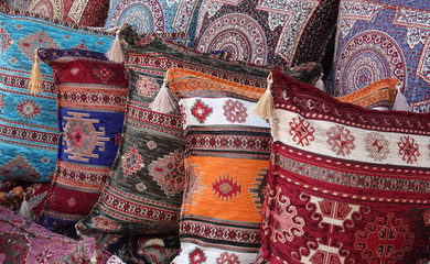 Colorful oriental pillows pile with decorative pattern