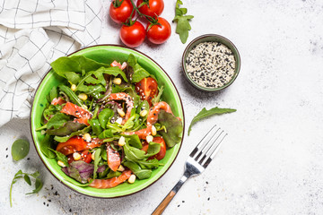 Salmon salad on white top view.
