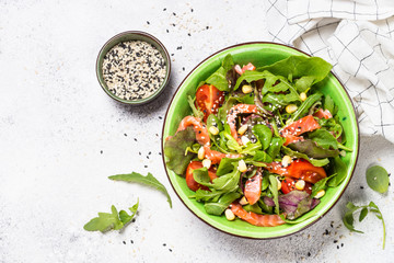 Salmon salad on white top view.