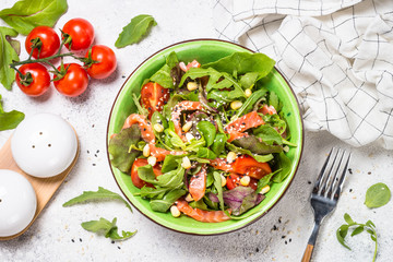 Salmon salad on white top view.