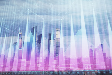 Multi exposure of financial chart on Moscow city downtown background. Concept of stock market analysis