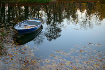 old fishing boat in the pond