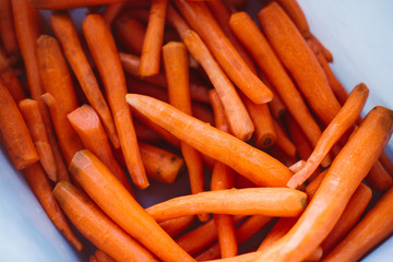 Lot of peeled carrots for carrot juice.  Raw vegan food. Autumn harvest.