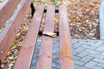 Fototapeta premium lost children's mittens lying alone on a bench in the Park